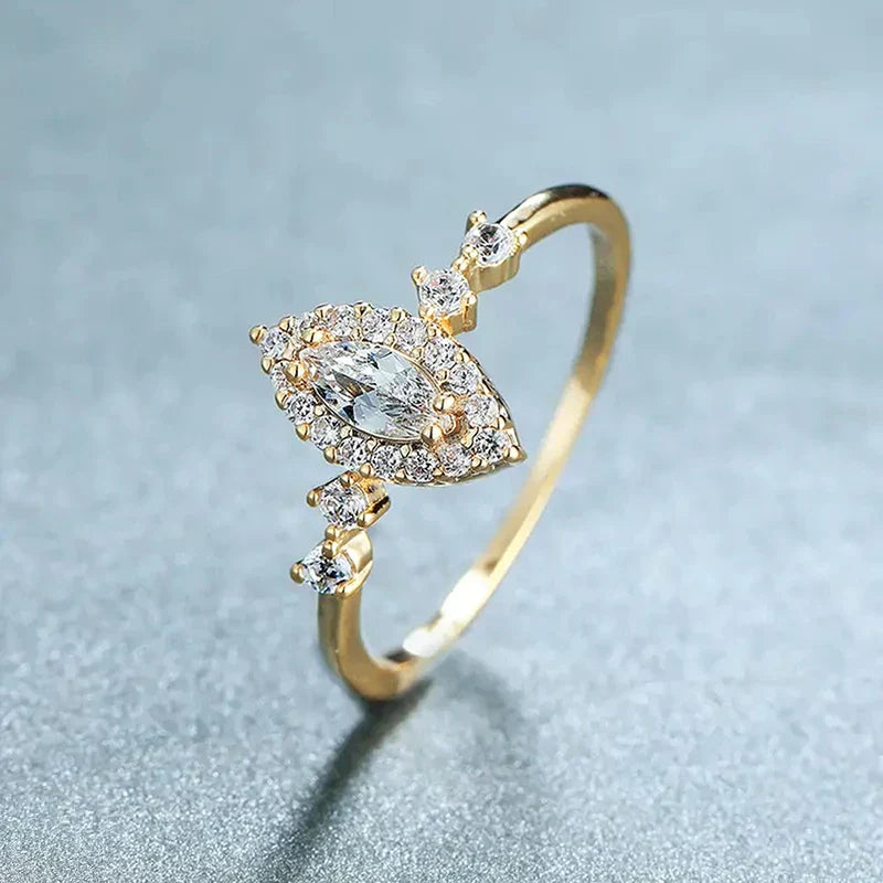 Huitan exquisite wedding ring with marquise cubic zirconia and gold-tone engagement band