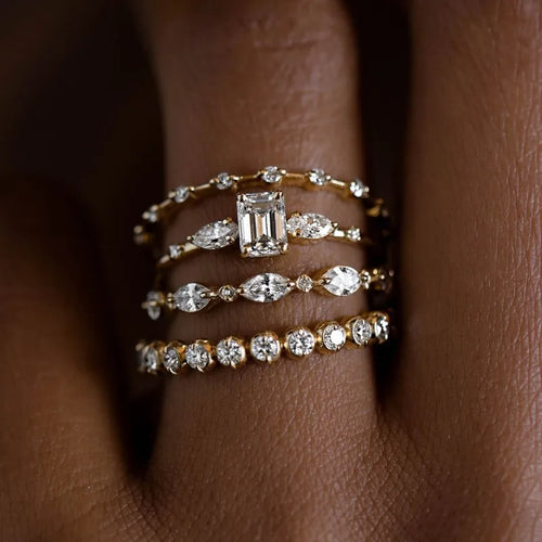 4-piece Art Deco Bridal Set with cushion-cut halo engagement ring and mixed eternity bands in 14k white gold