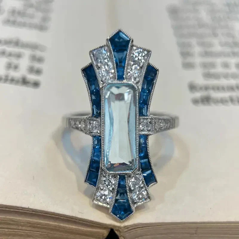 Huitan Luxury Lady Temperament Ring with blue cubic zirconia and polished metal band