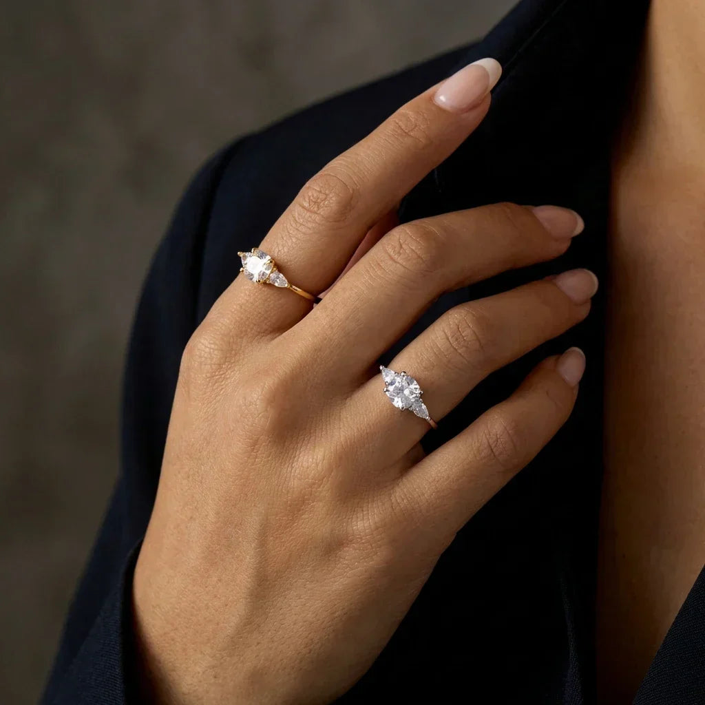 Minimalist dainty brilliant ring with pear-cut zircon side stones on polished brass band